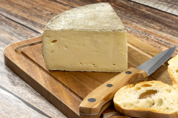 istock cheese: tomme de Savoie, close-up, on a table 2154413535