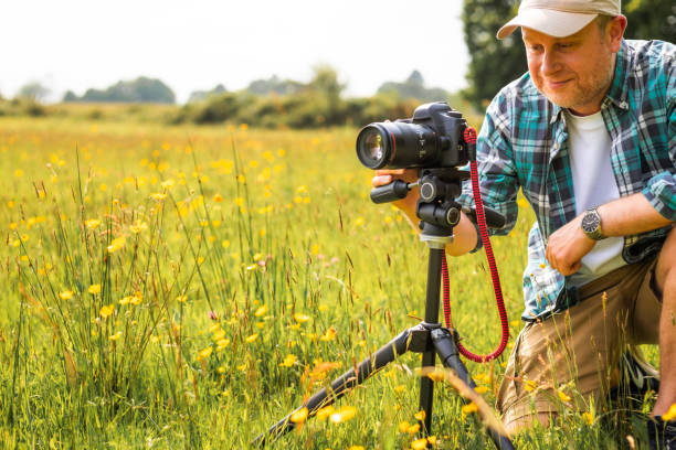 istock Happy photographer at work in nature 2154413847