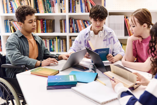 istock Inclusive Group of Students Doing Homework in Library 2154414851