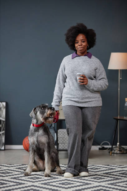 istock Woman ready for morning walk with dog 2154415735