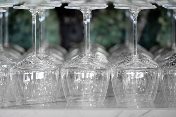 istock Wine glasses arranged upside down on the marble counter at the bar 2154418930