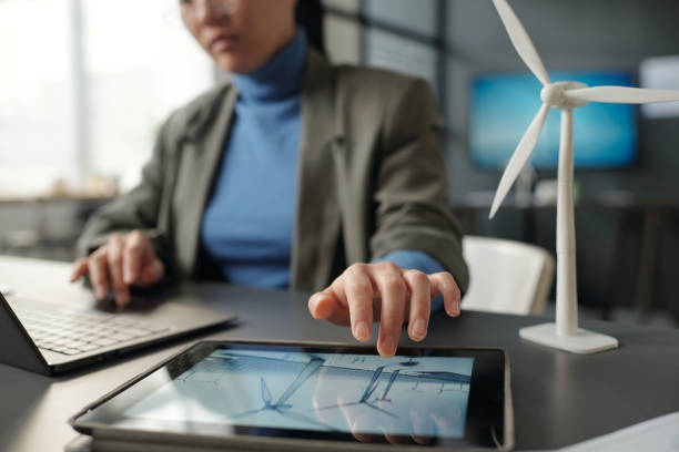 istock Hand of architect over tablet screen 2154421898