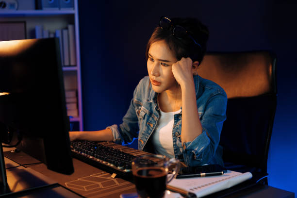 istock Stressful asian creative looking on pc to search project creator. Stratagem. 2154422132
