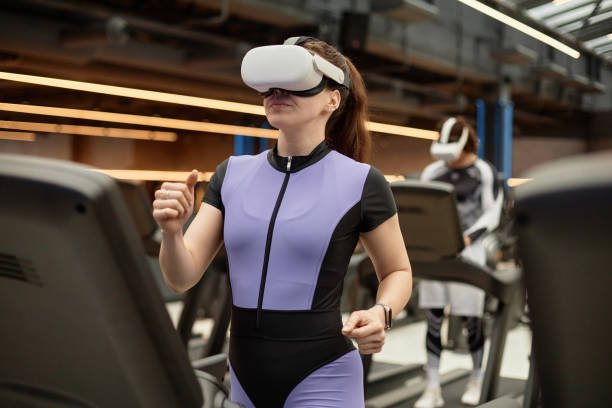 istock Girl Wearing VR Headset Running on Treadmill 2154423009