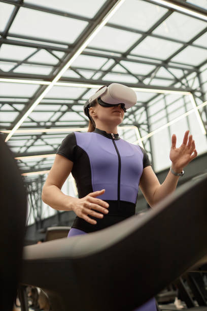 istock Low Angle Girl Running on Treadmill VR 2154423018