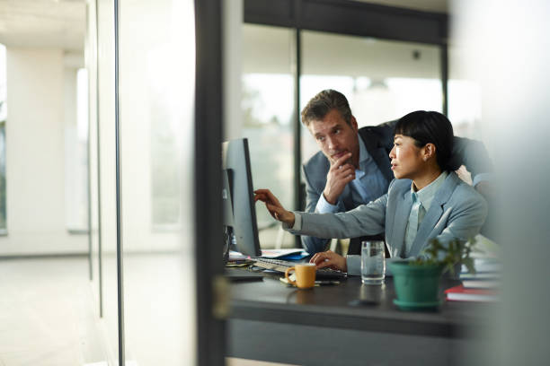 istock Diverse business colleagues surfing the Internet on PC in the office. 2154424988
