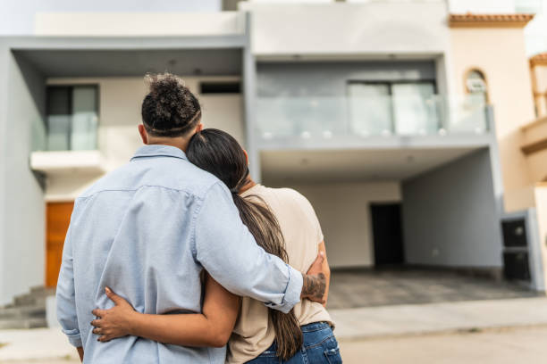 istock Couple embracing looking for the new house 2154425229