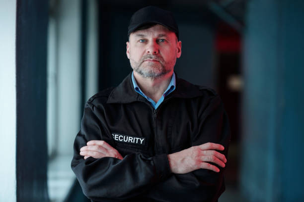 istock Serious male guard with crossed arms 2154426610