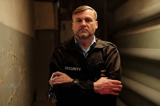 istock Male security guard with bunch of keys 2154426636