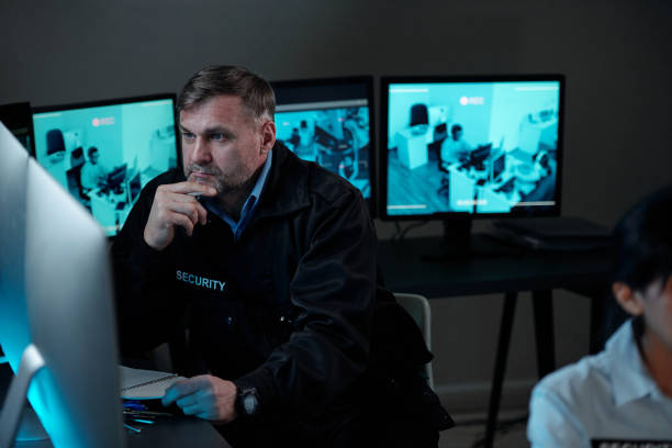 istock Concentrating on watching cctv video 2154426665