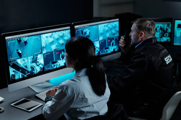 istock Officers in front of computer monitors 2154426700