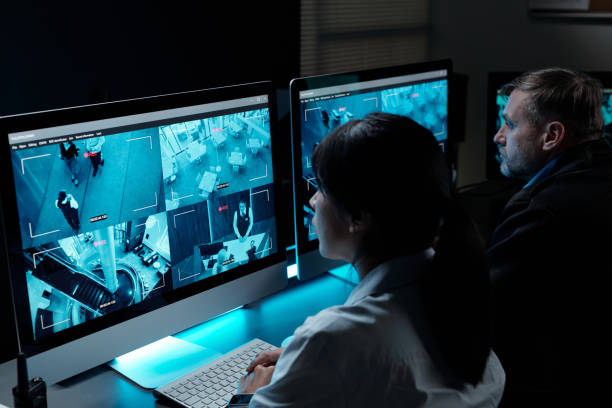 istock Guards observing cctv video on screens 2154426714