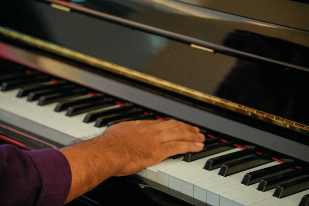 istock Male pianist playing piano, close-up 2154426908