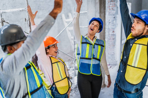 istock Coworkers celebrating on construction site 2154426985