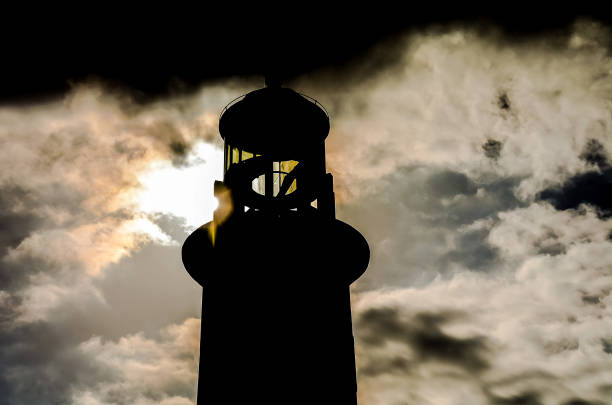 Obsolete lighthouse on the coast of Scotland on a stormy autumn afternoon