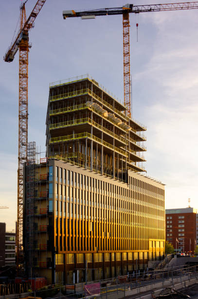 Building construction site in night, look up view