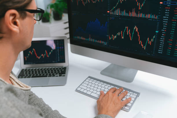 istock Business trader using computer and laptop to search high profit. Pecuniary. 2154430632