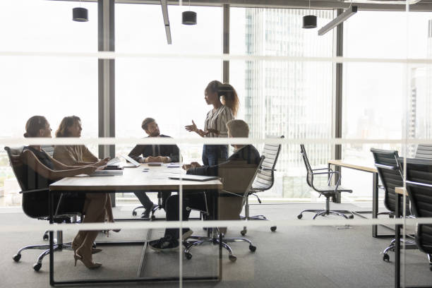 istock Diverse business group meeting at table in modern urban office 2154431085