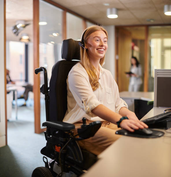 young disabled woman working at her desk in an office
