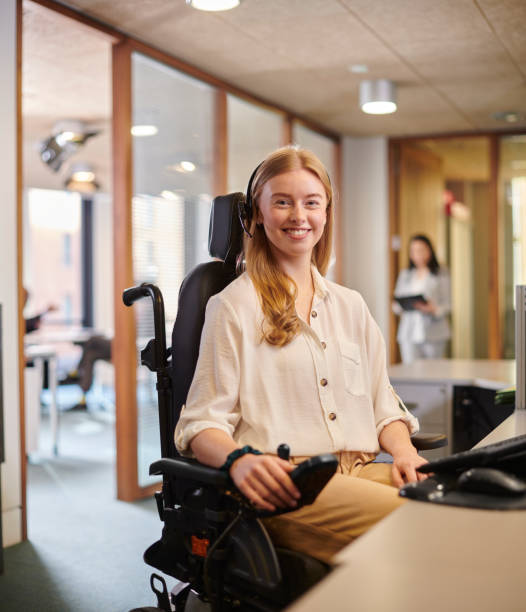 istock young disabled woman working at her desk in an office 2154432683