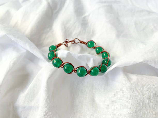 istock Handmade bracelet with green beads. 2154432860
