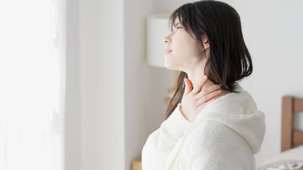 istock A woman caring about her sore throat 2154433259