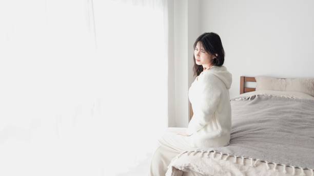 istock A woman caring about her aching shoulder 2154433449
