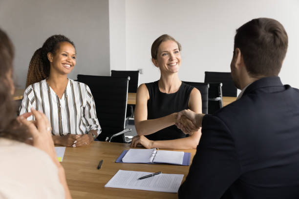 istock Happy successful diverse female managers discussing successful project 2154434099