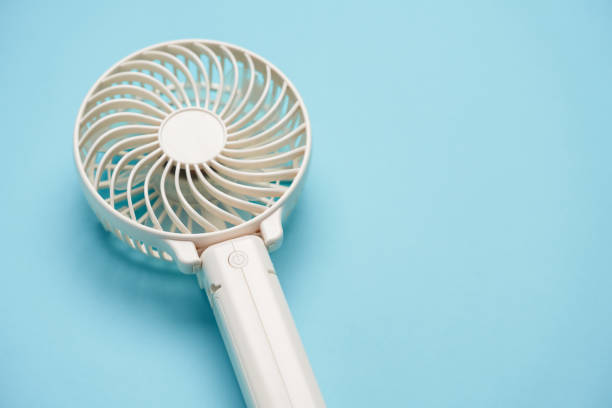 istock Portable electric fan on color background 2154435618