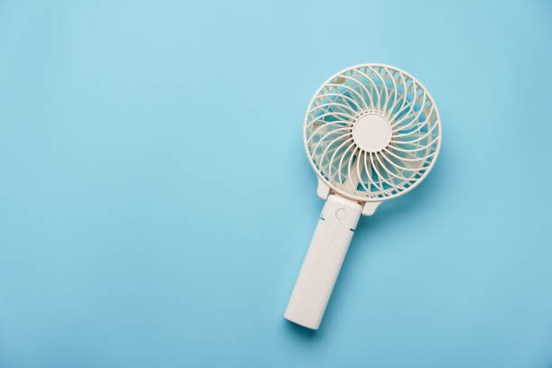 istock Portable electric fan on color background 2154435625