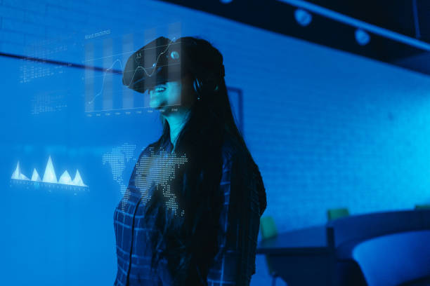 istock Businesswoman using VR glasses and looking for augmented reality in the office 2154435738