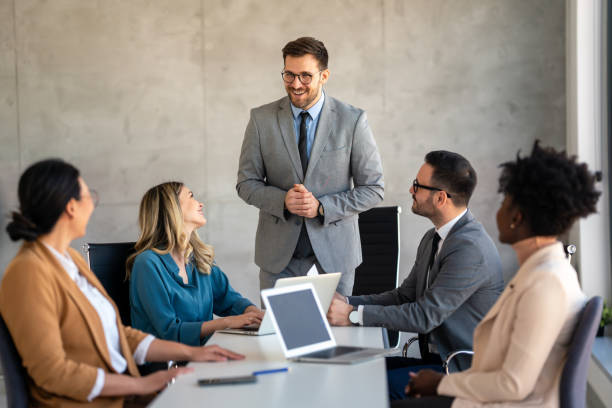 istock Multicultural professional businesspeople working together on research plan in boardroom. 2154437451