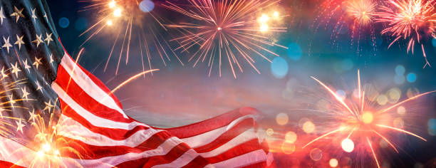istock Independence Day - Usa Flag And Fireworks At Night - Abstract Bokeh Light Effects 2154439395