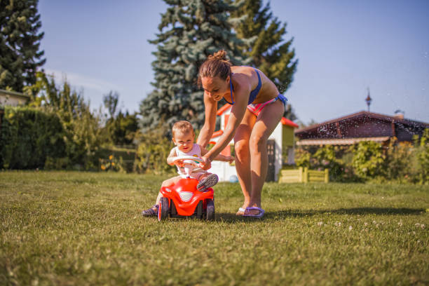 istock Mother playing with her son outdoors in the back yard 2154439406