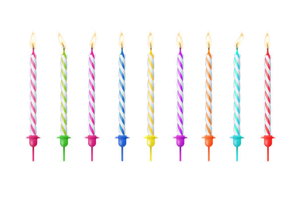 istock 3d realistic colorful candles for birthday cake. Holiday candles with burning flames candlelight on wicks, celebration objects. Vector 2154445309