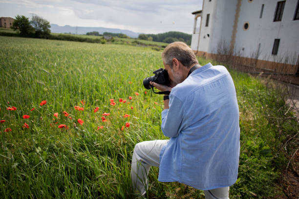 istock Older man taking pictures outdoors 2154447048