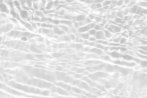 istock Blue water with ripples on the surface. Defocus blurred transparent blue colored clear calm water surface texture with splashes and bubbles. Water waves with shining pattern texture background. 2154450054