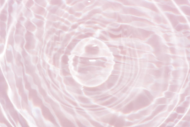 istock Blue water with ripples on the surface. Defocus blurred transparent blue colored clear calm water surface texture with splashes and bubbles. Water waves with shining pattern texture background. 2154450145