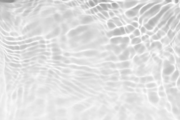 istock Blue water with ripples on the surface. Defocus blurred transparent blue colored clear calm water surface texture with splashes and bubbles. Water waves with shining pattern texture background. 2154450221