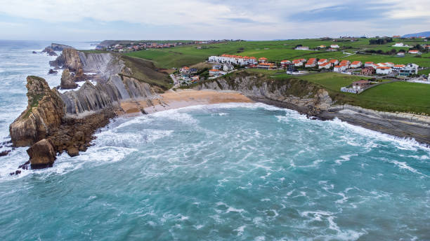 istock Portio Beach aerial view, sharp cliffs, rock formations, ocean. Cantabria, Spain. 2154452791