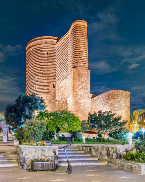 Baku's Old City with the historic Maiden Tower in the foreground, against a clear sky.