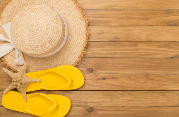 istock Flat lay with colorful beach accessories on wooden background. Vacation concept 2154452906