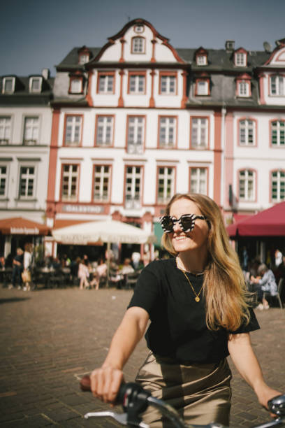 istock Young woman explores colourful, narrow streets 2154453300