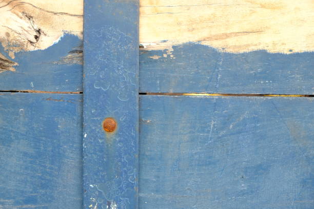 stacked blue wooden planks, nailed. This image is suitable for use as a background or wallpaper. old wooden door.