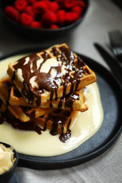 istock Dutch waffles with vanilla sauce, chocolate and berries. 2154456904