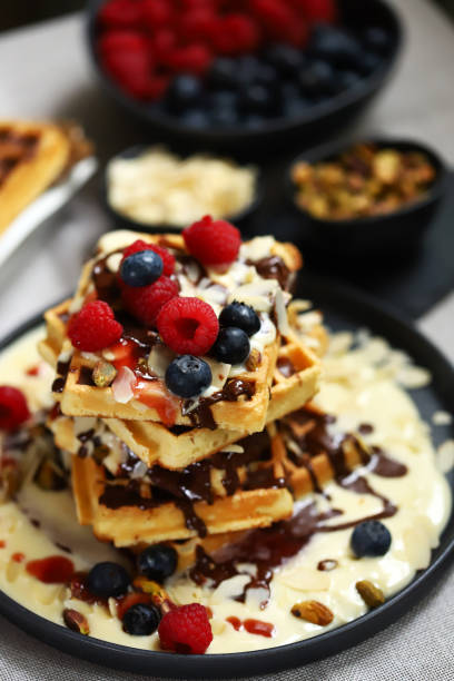 istock Dutch waffles with vanilla sauce, chocolate and berries. 2154456929