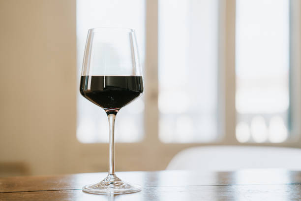 istock A glass of red wine on the table at home 2154457476