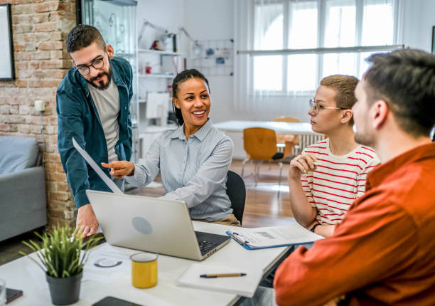 istock Young multi-ethnic businesspeople working together 2154458660