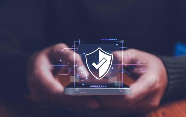 istock Cyber security. Business, technology, internet and networking concept. Young business man working on his laptop in the office, select the icon security on the virtual display. 2154458701