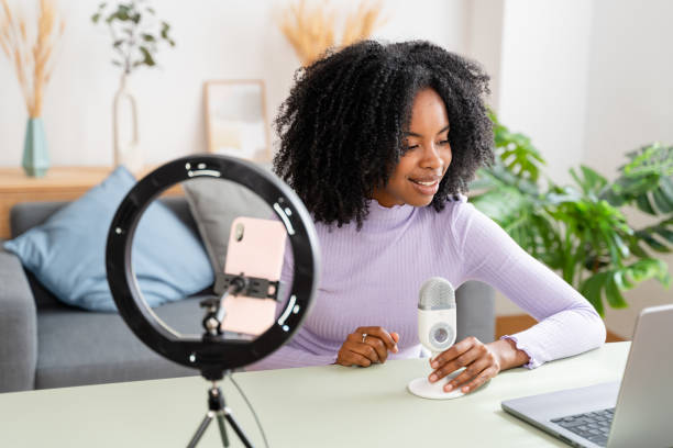 istock Young female content creator recording podcast at home 2154460180